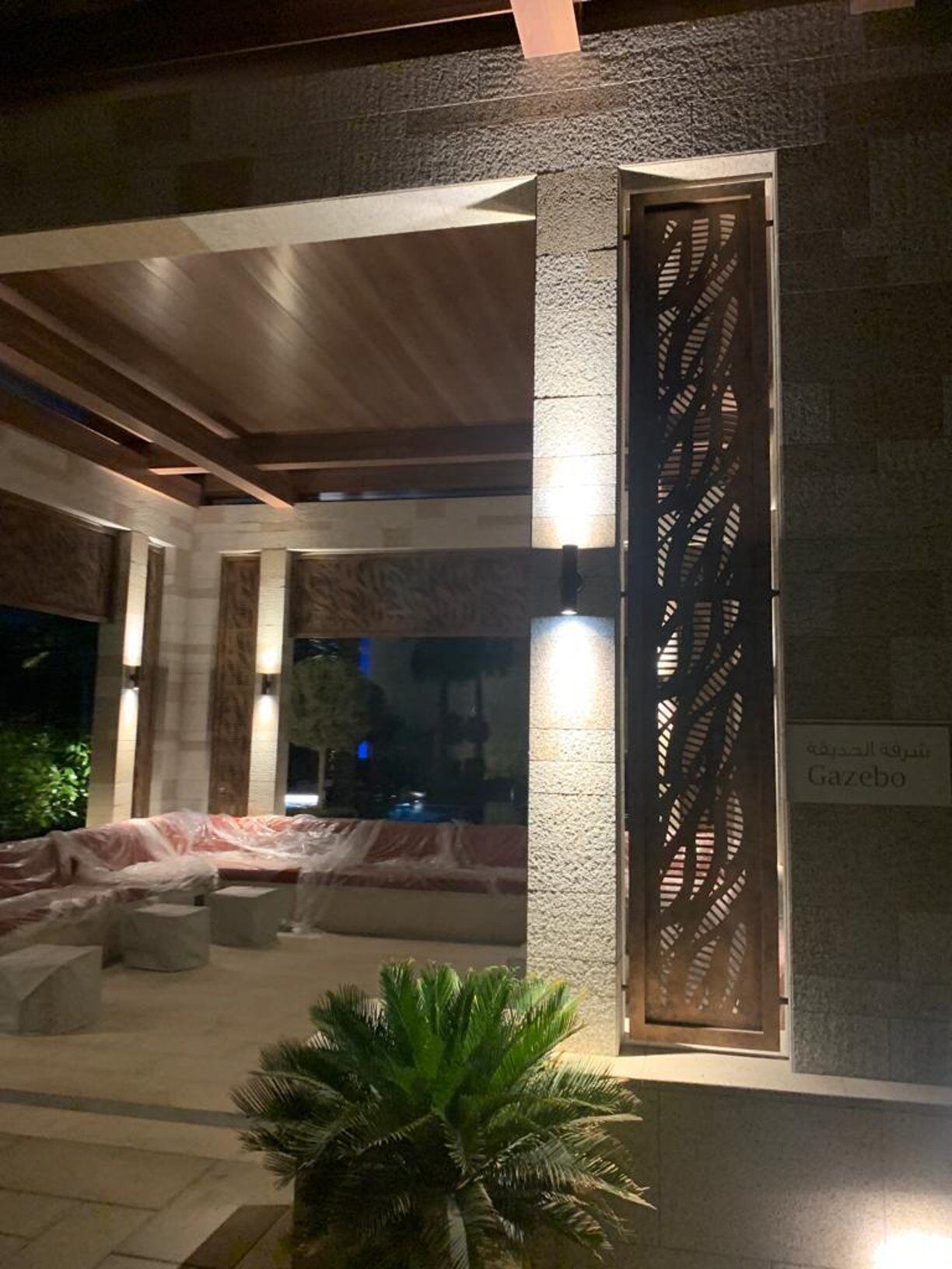 Grand villa entrance lit with warm cove lighting, Saudi Arabia